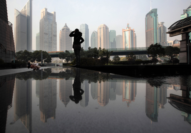 Commercial buildings in the Pudong area of Shanghai.   Bloomberg