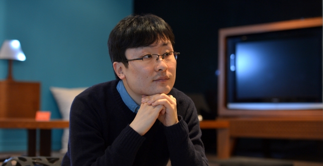 Filmmaker Park Moon-chil poses for a photo during an interview with The Korea Herald in central Seoul on Tuesday.   Yoon Byung-chan/The Korea Herald