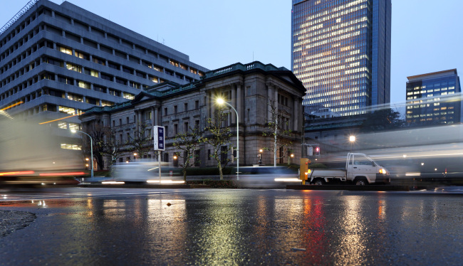 Traffic moves past the Bank of Japan headquarters in Tokyo.   Bloomberg
