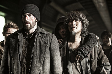 Chris Evans (left) and Song Kang-ho appear in “Snowpiercer.”  CJ Entertainment