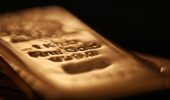 A gold bar is seen in this arranged photograph at Gold Investments Ltd. bullion dealers in London.   Bloomberg