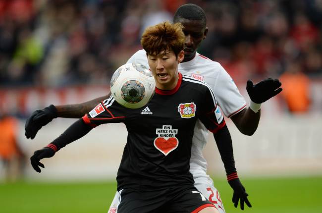 Bayer Leverkusen’s Son Heung-min controls the ball against Stuttgart defender Antonio Ruediger.   AFP-Yonhap