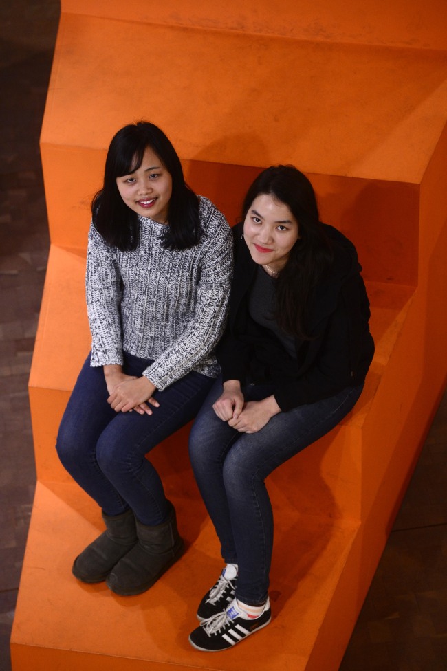 Liu Jing (left) and Mary Tarakey pose at the Seoul Museum of Art headquarters in Seoul where they work as student interns.   Park Hae-mook/The Korea Herald