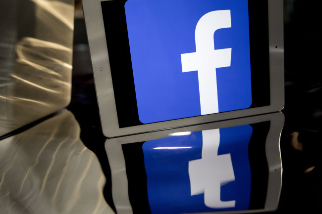 The Facebook Inc. logo is displayed on iPad Air in this photograph.   Bloomberg