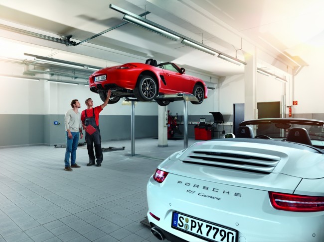 Certified technicians at a Porsche service center inspect and repair vehicles.   Porsche Korea