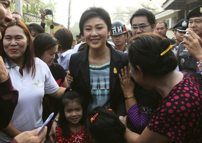 Thai Prime Minister Yingluck Shinawatra arrives to cast her ballot for the general election at a polling station in Bangkok on Sunday.    AP-Yonhap