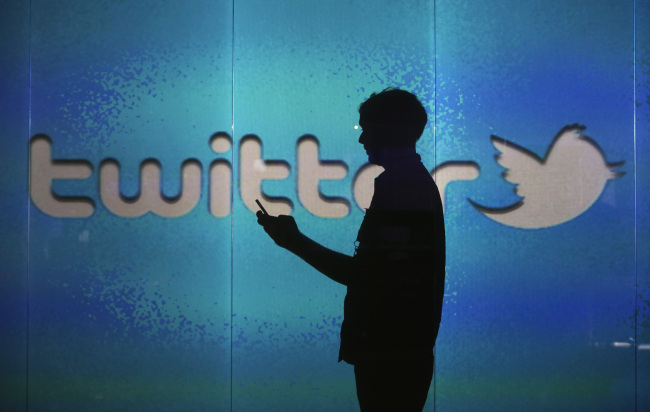 A user checks a Twitter feed on a smartphone in London.   Bloomberg