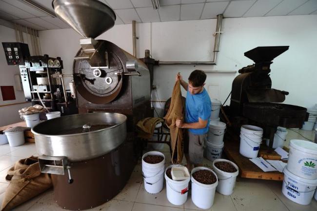 Jason Laurent works with cocoa beans at Marou, Vietnam’s first artisan chocolate maker in Ho Chi Minh City.   AFP