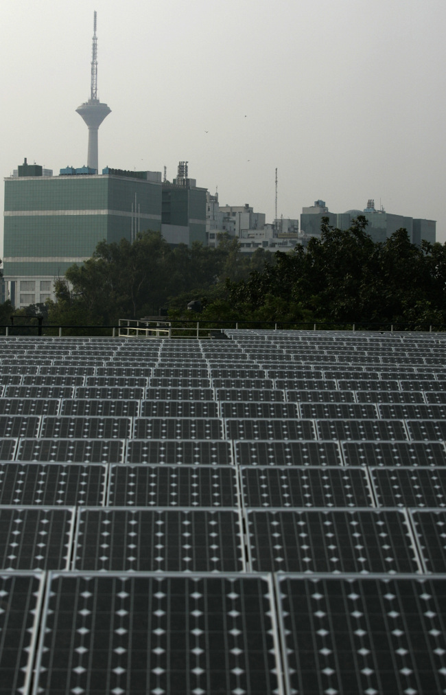 Solar panels manufactured by Tata BP Solar India Ltd. stand at North Delhi Power Ltd.’s Keshavpuram power station in New Delhi.   Bloomberg