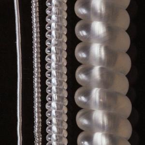 This photograph compares artificial muscles produced by coiling polymer fibers made from polyethylene and nylon. From left: 150 micrometer, 280 micrometer, 860 micrometer and 2.45 millimeter fibers.   Science