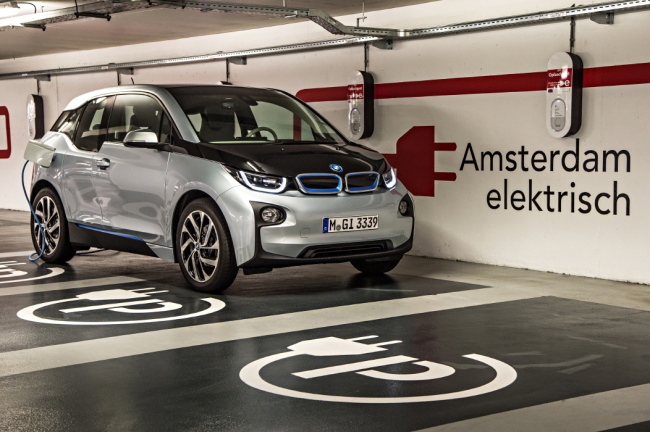 The BMW i3 charges in a parking lot.   BMW Korea
