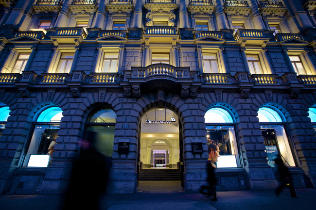 Lights illuminate windows at Credit Suisse Group AG’s headquarters bank branch in Zurich, Switzerland.   Bloomberg