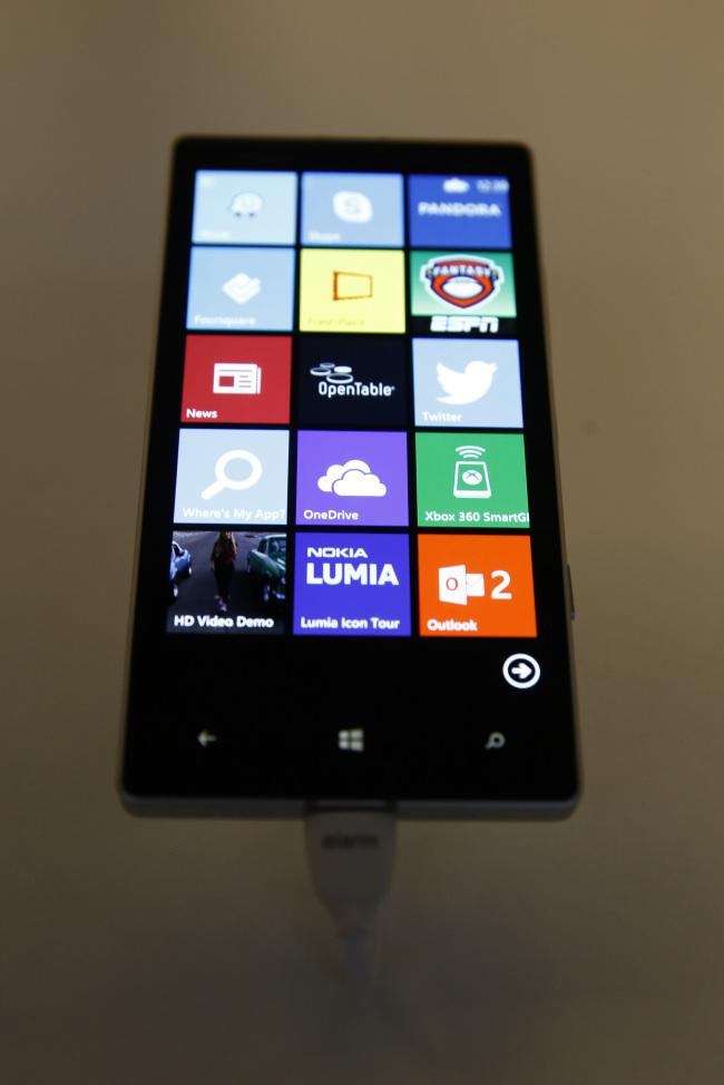A Nokia Oyj Lumia Icon smartphone sits on display at a Microsoft news conference.   Bloomberg
