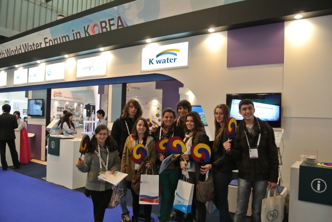 Visitors pose at the Korean booth during the 2012 World Water Forum in Marseille, France.   K-water