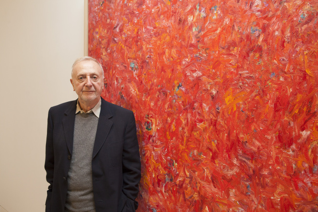 Artist Jean-Marie Haessle poses for a photo by one of his paintings at Korea University Museum in Seoul on Tuesday.   Jongheon Martin Kim/Kips Gallery New York