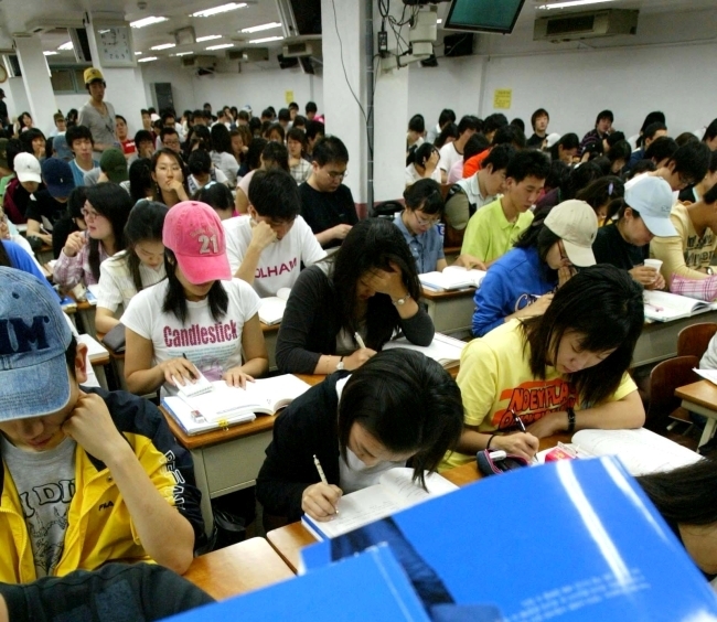 Students attend an English-language class in Seoul.   The Korea Herald