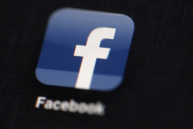 The Facebook logo is displayed on an iPad in Philadelphia.    AP-Yonhap