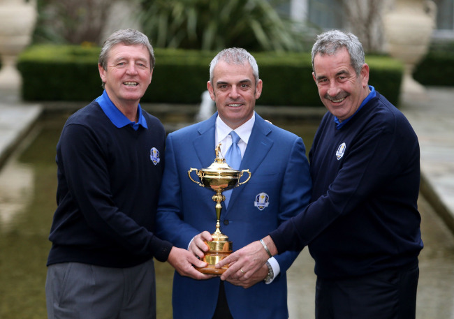 Europe Ryder Cup captain Paul McGinley (center) holds the trophy with Des Smyth (left) and Sam Torrance after a press conference in Dublin on Thursday.   AP-Yonhap