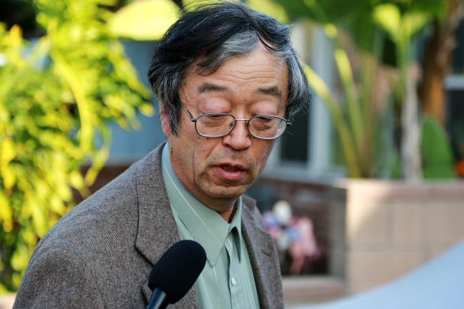 Dorian S. Nakamoto, identified by Newsweek magazine as the founder of Bitcoin, speaks to members of the media as he arrives home in Temple City, California, Thursday.   Bloomberg