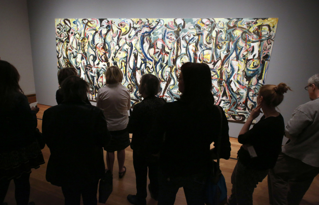 Members of the media preview Jackson Pollock’s “Mural” at the J. Paul Getty Museum in Los Angeles on Monday.   AP-Yonhap