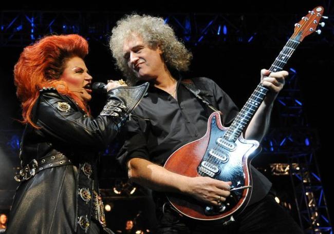 Former Queen guitarist Brian May (right) and dancer Brigitte Oelke perform in the musical “We Will Rock You” in Berlin in 2010.    AFP