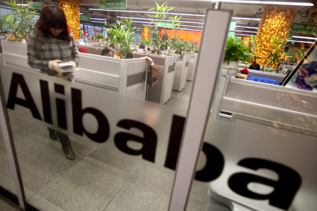 Employees work at Alibaba.com Ltd.’s headquarters in Hangzhou, Zhejiang Province, China.   Bloomberg