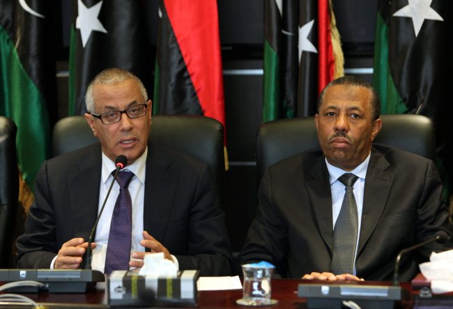 Libyan Prime Minister Ali Zidan (left) and Minister of Defense Abdullah al-Thani attend a press conference with members of the government in Tripoli in November 2013.  EPA-Yonhap