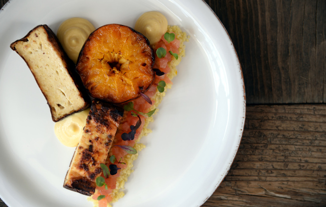 When ordered for brunch, Harvest Namsan’s baked ricotta cake with tomato couscous is paired with a grilled Jejudo Island “cheonhyehyang” tangerine. (Ahn Hoon/The Korea Herald)