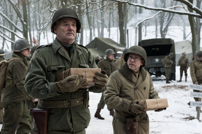 Preston Savitz (Bob Balaban, right) and Richard Campbell (Bill Murray) collect their care packages on the set of Columbia Pictures’ movie “The Monuments Men.” (Columbia Pictures/MCT)