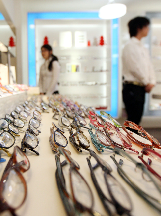 Eyeglasses are displayed at a shop in Tokyo.   Bloomberg