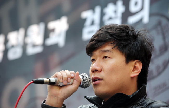 Yoo Woo-seong, a former Seoul City official accused of espionage, speaks at a press conference, accusing the spy agency and the prosecution of fabricating evidence against him on Saturday in Seoul.   Yonhap