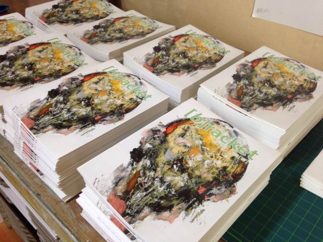 Copies of the March issue of (b)racket await distribution.   Jess Hinshaw