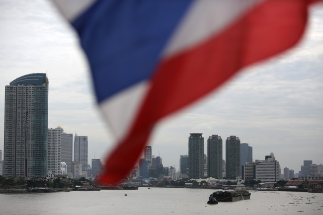 The Thai national flag flies on the Krungthep Bridge in Bangkok.    Bloomberg
