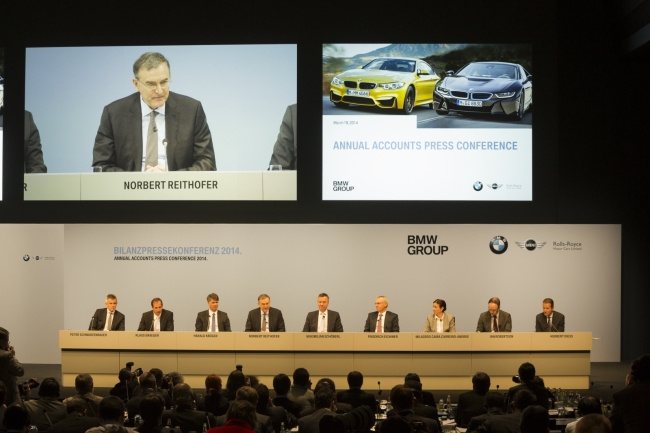 BMW chief executive Norbert Reithofer (also seen on the screen) and other board members attend the carmaker’s annual results press conference on Wednesday at BMW Welt in Munich.   BMW Korea