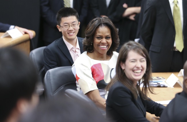 U.S. first lady Michelle Obama talks with students after her speech at Stanford Center at Peking University in Beijing on Saturday.   Xinhua-Yonhap