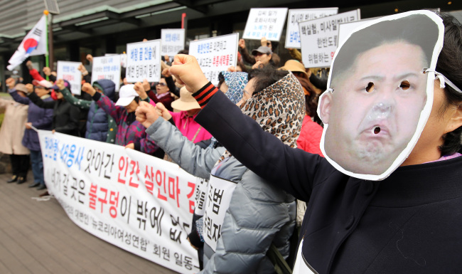 Female North Korean defectors condemn the communist state’s leader Kim Jong-un for the 2010 torpedo attack on the South Korean corvette Cheonan during a rally near Gwanghwamun Plaza in central Seoul on Wednesday.   Yonhap