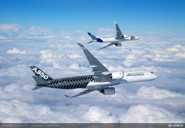 Two test models of the A350 take to the skies above Toulouse, France, in February 2014, for their first flights.   Airbus