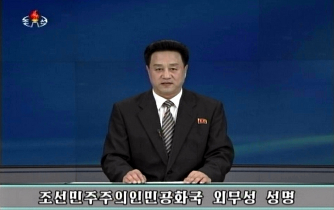 A North Korean TV announcer delivers a statement issued by the North’s Foreign Ministry on Sunday. (Yonhap)