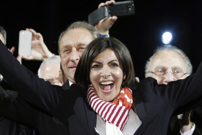 French Socialist Party deputy mayor of Paris, Anne Hidalgo, smiles during a speech in Paris on Sunday.   AP-Yonhap