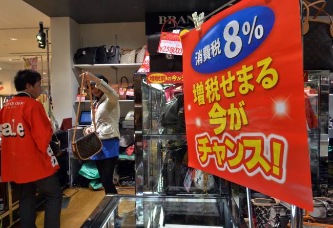 A customer checks products at a shop in Chiba, Tokyo, Saturday.    AFP-Yonhap