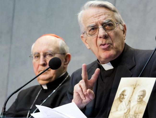Director of the Holy See press room Father Federico Lombardi (right), flanked by Cardinal Agostino Vallini, speaks during a press conference at the Vatican on Monday.   AP