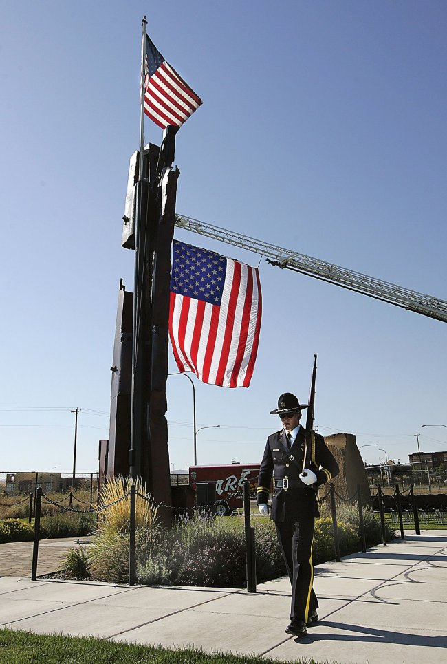 A member of the Fraternal Order of Police Honor Guard patrols on Sept. 11, 2013, at the 9/11 Memorial in Kennewick, Washington.   Richard Dickin/Tri-City Herald/MCT