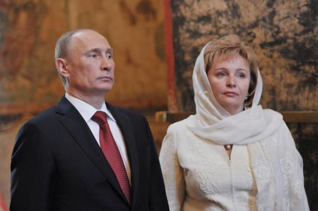 A file picture taken on May 7, 2012, shows Russian President Vladimir Putin and his wife Lyudmila attending a memorial service at Blagoveshchensky Cathedral in Moscow.   AFP