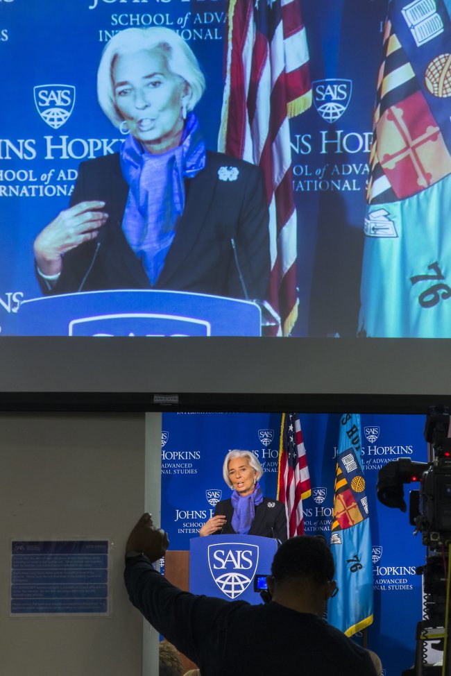 International Monetary Fund Managing Director Christine Lagarde is seen on a projection screen as she holds a discussion on the state of the global economy at the Johns Hopkins School of Advanced International Studies in Washington, D.C., Wednesday.    EPA-Yonhap