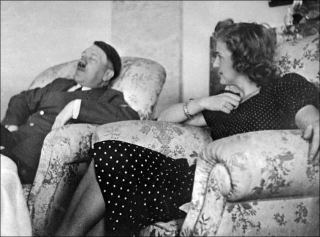 Nazi leader Adolf Hitler is seen relaxing with his mistress Eva Braun, who would later become his wife.   AFP