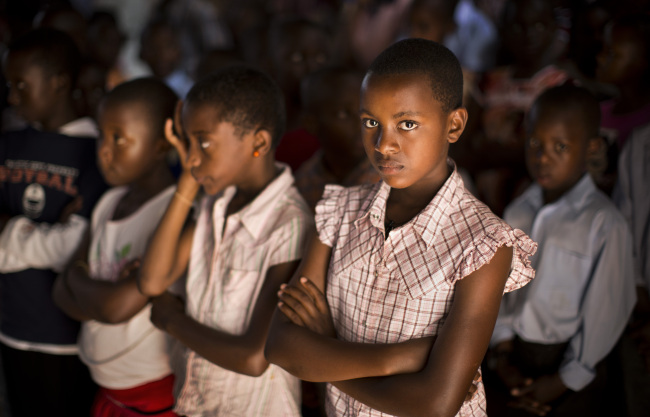 Rwandan children listen and pray during a Sunday morning service at the Saint-Famille Catholic church, the scene of many killings during the 1994 genocide, in the capital Kigali, Rwanda, Sunday.   AP-Yonhap
Rwandan children listen and pray during a Sunday morning service at the Saint-Famille Catholic church, the scene of many killings during the 1994 genocide, in the capital Kigali, Rwanda, Sunday.   AP-Yonhap