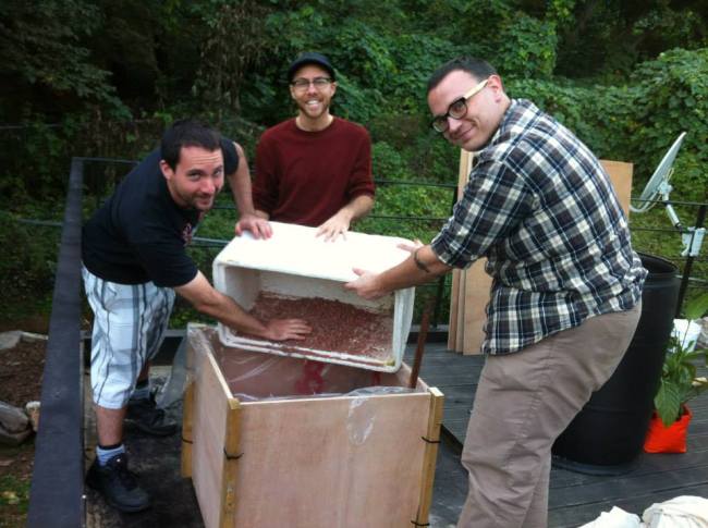 Justin Pollard (right) helps create a container pot for plants that is designed to reduce watering needs.   Seoul City Farmers