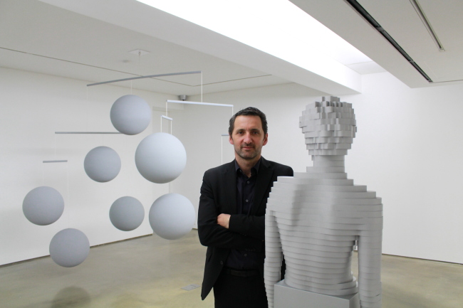 French artist Xavier Veilhan poses with his works at 313 Art Project in Seoul.   313 Art Project