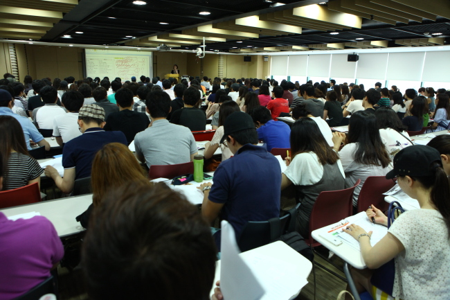 People sit attend a private English class at Pagoda Academy in Seoul.   Pagoda Academy