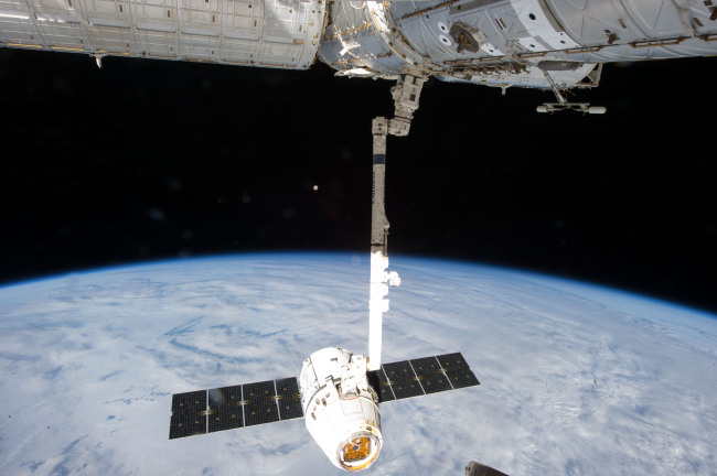 This March 26, 2013, file photo shows the release of the SpaceX Dragon-2 spacecraft from the International Space Station.   AP-Yonhap
